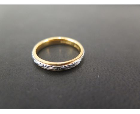 A 22ct gold bi-colour textured band ring - Size M - Weight approx 4.4gms
Condition Report: Good - With light scratches