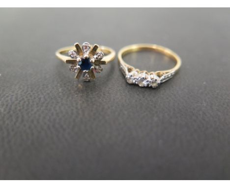 A sapphire and diamond snowflake cluster ring - Size G 1/2 - Together with a diamond three-stone ring - Ring size M - Both st