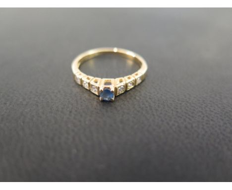 A sapphire and diamond ring - Stamped 750 - Ring size O - Weight approx 2.1gms
Condition Report: Good to fair - With light su