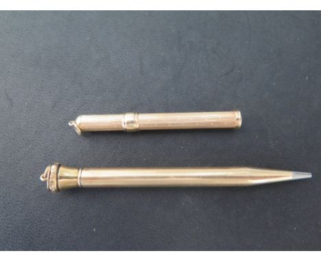 A 14 ct gold Propelling Pencil stamped 585 on the ring together with a 14 ct gold pencil holder with retractable slide action