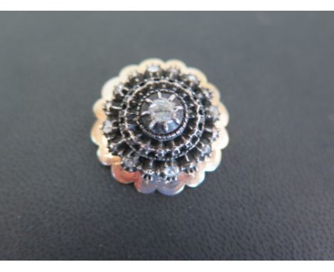 A diamond domed brooch - Set with rose-cut diamonds to the scalloped edge - Tests as silver and gold - Diameter 2.5cms - Weig