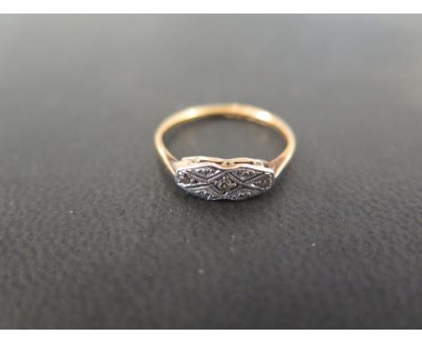 A diamond panel ring - Stamped 18ct - Ring size K 1/2 - Weight approx 1.6gms
Condition Report: Good to fair - With some surfa