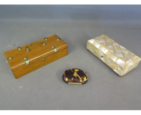A mother of pearl trinket box on bun feet - Length 16 cm - with some loses to mother of pearl and a similar size oak box with