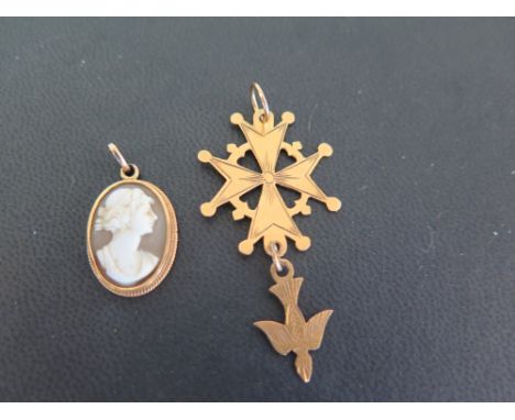 A cross pendant - With foreign marks for higher carat gold - Length 5cms - Weight approx 2.6gms - Together with a shell cameo