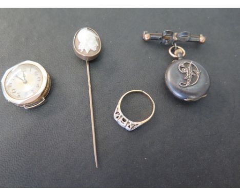 A collection of vintage jewellery to include a gun metal and gold ladies fob or brooch watch, the back set with a letter D in