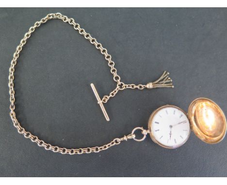 A Ladies Continental 14 ct gold Full Hunter fob or pocket watch with 14 cm gold watch chain - the watch stamped 14 K in front