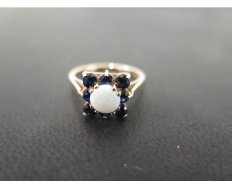 A 9ct gold opal and sapphire cluster ring - Hallmarked London - Ring size M 1/2 - Weight approx 2.5gms
Condition Report: Good