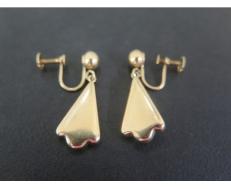 A pair of ear pendants - Each designed as a fan-shape drop to the ball surmount and screw-back fitting - Stamped 14K - Length