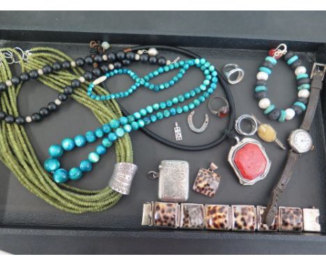 An assortment of silver, bead and costume jewellery - To include a silver vesta case, a watch, a jade bead multi strand neckl