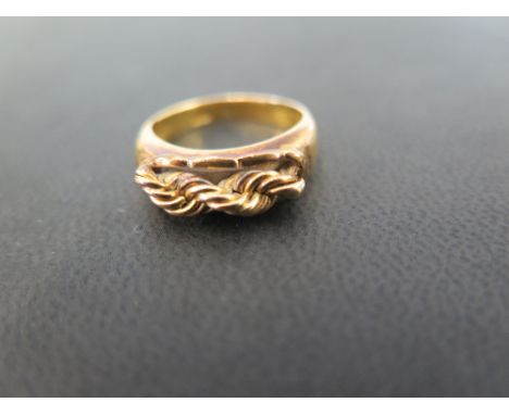 A rope-twist panel ring - Stamped 22K - Ring size M - Weight approx 5.8gms
Condition Report: Good to fair - With light surfac