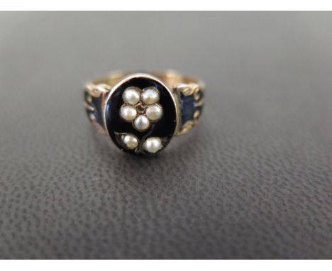 A late 19th century seed pearl and enamel memorial ring -  With woven hair panel to the reverse - Tests as higher carat gold 