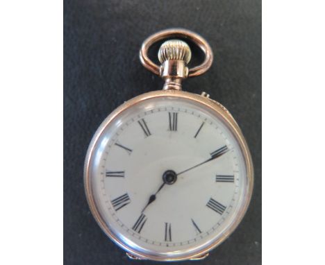 A Ladies 18 ct gold fob watch stamped K18 in back cover - white enamel face with Roman numerals appears un-damaged, case with