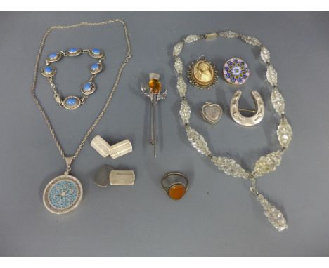 An assortment of silver and costume jewellery - To include a locket, a pair of cufflinks, together with further items