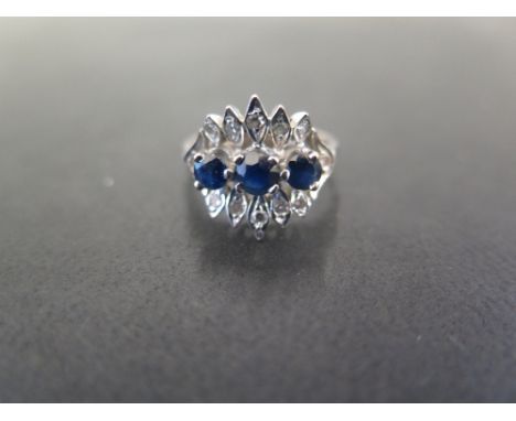 An 18ct gold sapphire and diamond dress ring - Hallmarked London - Ring size K - Weight approx 4.2gms
Condition Report: Good 