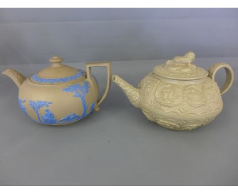 An early Wedgwood pottery Jasperware teapot and lid together with Wedgwood drabware teapot decorated with a King Charles Span