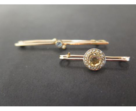 An early 20th century 15ct gold aquamarine and seed pearl bar brooch - Length 5.2cms - Weight approx 2.2gms - Together with a