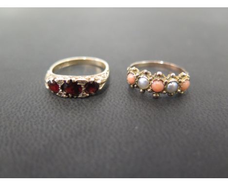 A 9ct gold garnet and diamond boat-shape ring - Hallmarked Birmingham - Ring size L 1/2 - Together with a seed pearl and cora