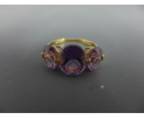 An amethyst three-stone ring - Stamped 9K - Ring size R - Weight approx 2.5gms
Condition Report: Good
