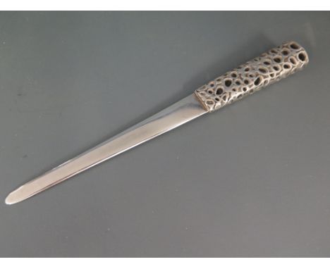 A 20th century silver letter opener with honey comb handle by Graham Watling - impressed marks GW London 1977 - Weight approx