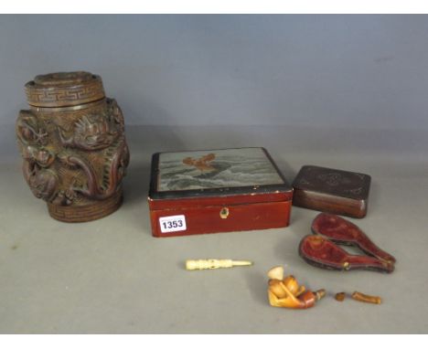 A Chinese carved hardwood tobacco jar, a Japanese lacquered box, a Japanese hardwood box with metal inlay, a Meerschaum pipe 