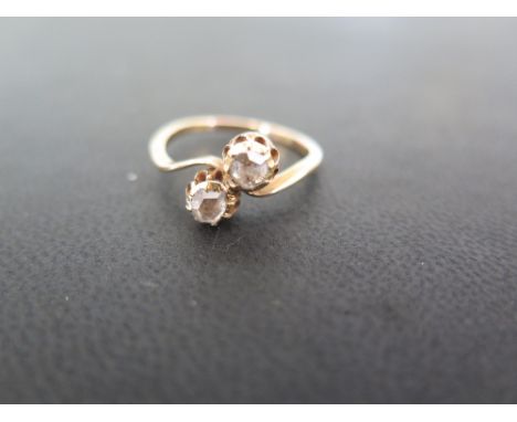 A rose-cut diamond two-stone ring - Tests as higher carat gold - Ring size O 1/2 - Weight approx 2.6gms
Condition Report: Goo