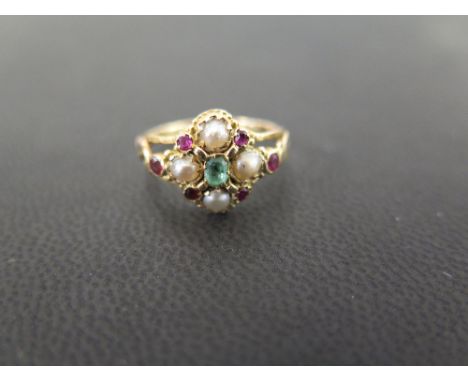 An emerald, ruby and seed pearl cluster dress ring - Tests as higher carat gold - Ring size J 1/2 - Weight approx 2.2gms
Cond