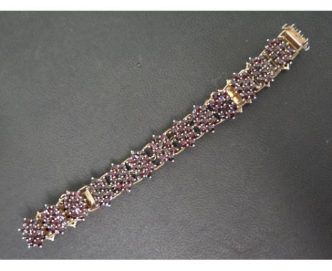 A bohemian garnet panel bracelet - Stamped 830 - Length approx 19cms - Weight approx 26.0gms
Condition Report: Good to fair -