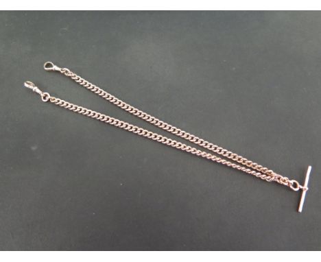 An early to mid 20th century 9ct gold double Albert chain - Suspending a t-bar and two toggles - Length 42cms - Weight approx