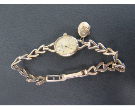EVERITE a 9ct gold ladies quartz wristwatch - With baton markers to the bracelet strap - Partial hallmark - Weight approx 9.5