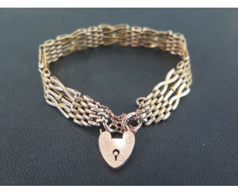 A five-bar gate bracelet - Stamped 9ct - Length 18cms - Weight approx 11.3gms
Condition Report: Good - With light scratches 