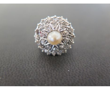 A cultured freshwater pearl and diamond cluster ring - The circular panel set with old-cut diamonds to the central cultured p