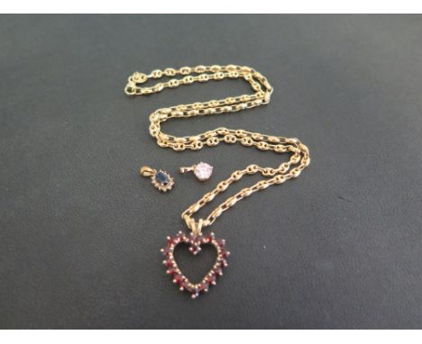 A garnet heart-shape pendant - Stamped 10K - Length 2.7cms - Suspended from a 9ct gold fancy-link chain - Hallmarked Sheffiel