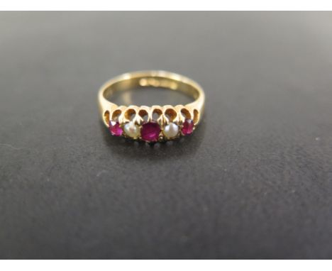 An early 20th century 18ct gold ruby and seed pearl ring - Hallmarked Chester, 1903 - Ring size O 1/2 - Weight approx 4.0gms
