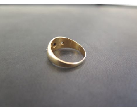 A 9ct gold aquamarine brooch - Hallmark rubbed - Width 4cms - A 9ct gold band ring -  Hallmarked Birmingham - Ring size K - T