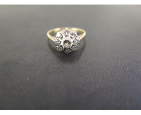 A diamond floral cluster ring - Set with brilliant-cut diamonds - Stamped 18ct - Ring size N - Weight approx 3.0gms
Condition