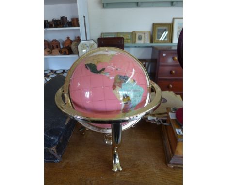 A large Terrestrial Globe inlaid with semi precious stones, Abalone etc. mounted on a heavy brass stand with Compass set base