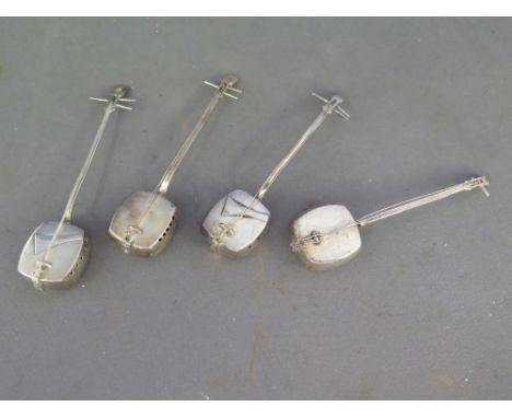 A set of four novelty silver condiments in the form of Japanese Shamisen - stringed instruments - stamped Sterling 950 - Weig