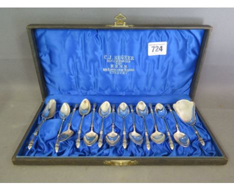 A boxed set of twelve Continental silver teaspoons together with a matching caddy spoon and sugar spoon - all stamped 800 - t