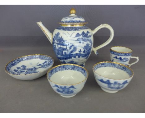 Five pieces of blue and white oriental china including a teapot, tea cup, two tea bowls and a dish - small rim chips to cup a