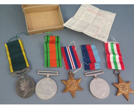 A World War II - a group of four medals unnamed and a Territorial medal to 878390 GNR. F.C Bennett R A 