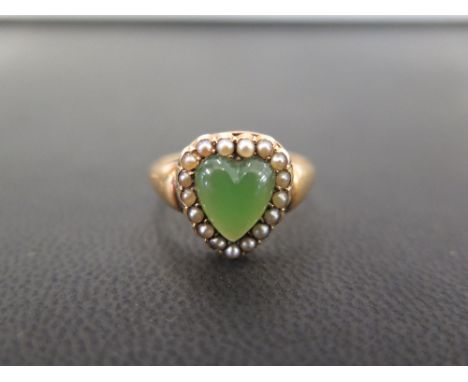 An 18ct gold green gem and seed pearl heart-shape ring - Believed to be jade - Hallmarked London - Ring size Q - Weight appro