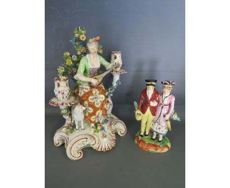 A 19th century Continental porcelain candelabra figure of a Shepherdess playing a flute, anchor stamp to back - Height 27 cm 