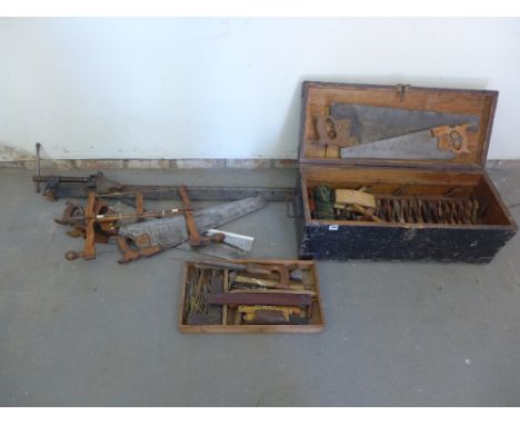 A collection of Vintage wood working tools with a pine tool chest - including moulding planes, saws and a 6'6" clamp