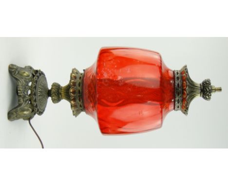 An American Falkenstein cast brass table lamp
with red glass shade, height 24.5".