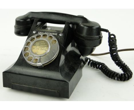 Vintage black Bakelite dial telephone.