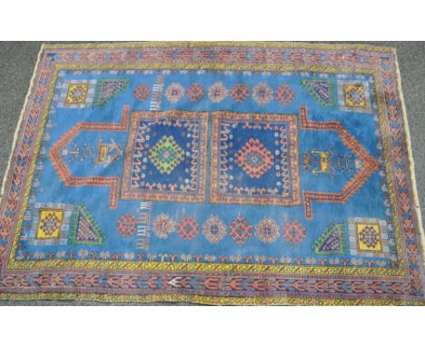 Circa 1930s blue ground Anatolian Caucasian design carpet,
9' x 6'3".