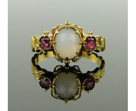 A Victorian unmarked gold 3 stone opal and ruby ring,
with engraved shoulders, setting height 10mm, size O.