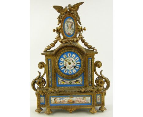 A French ormolu mantel clock,
with 2-train movement, having Sevres style enamel panels, height 1'6".