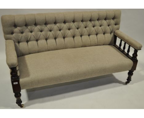 19th century Irish club sofa,
upholstered in Irish button back linen with carved mahogany showwood, length 5', height 2'11".