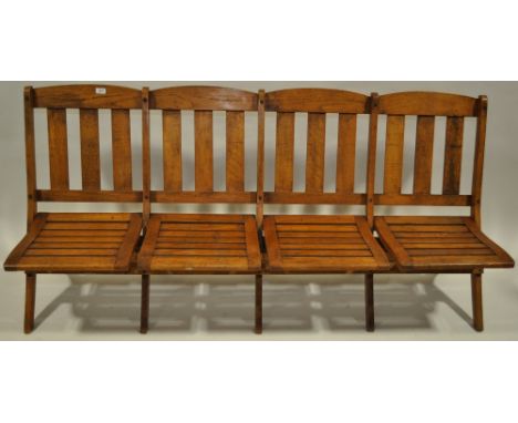 An oak folding 4 seater bench originally from a Cape Town railway station,
length 6', height 3'4".